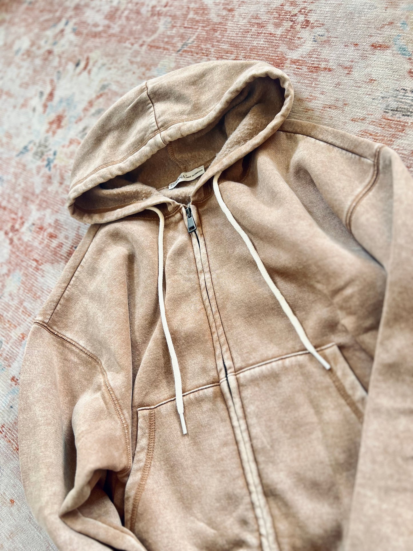 All in the Cozy Vintage Wash Hoodie in Camel